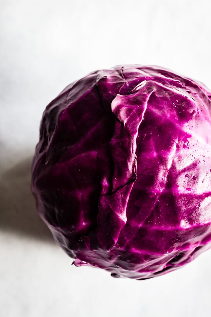 A beautiful purple cabbage on a white background.