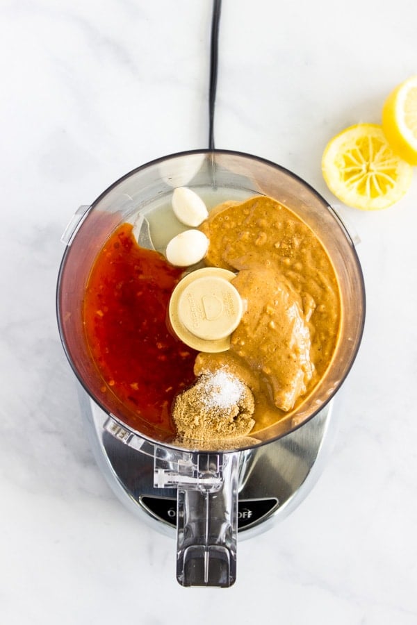 All of the ingredients for 5-Minute Peanut Sauce are ready to be mixed in a food processor.