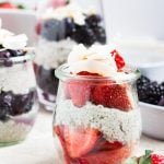 A coconut chia parfait with with fresh strawberries and blueberries.