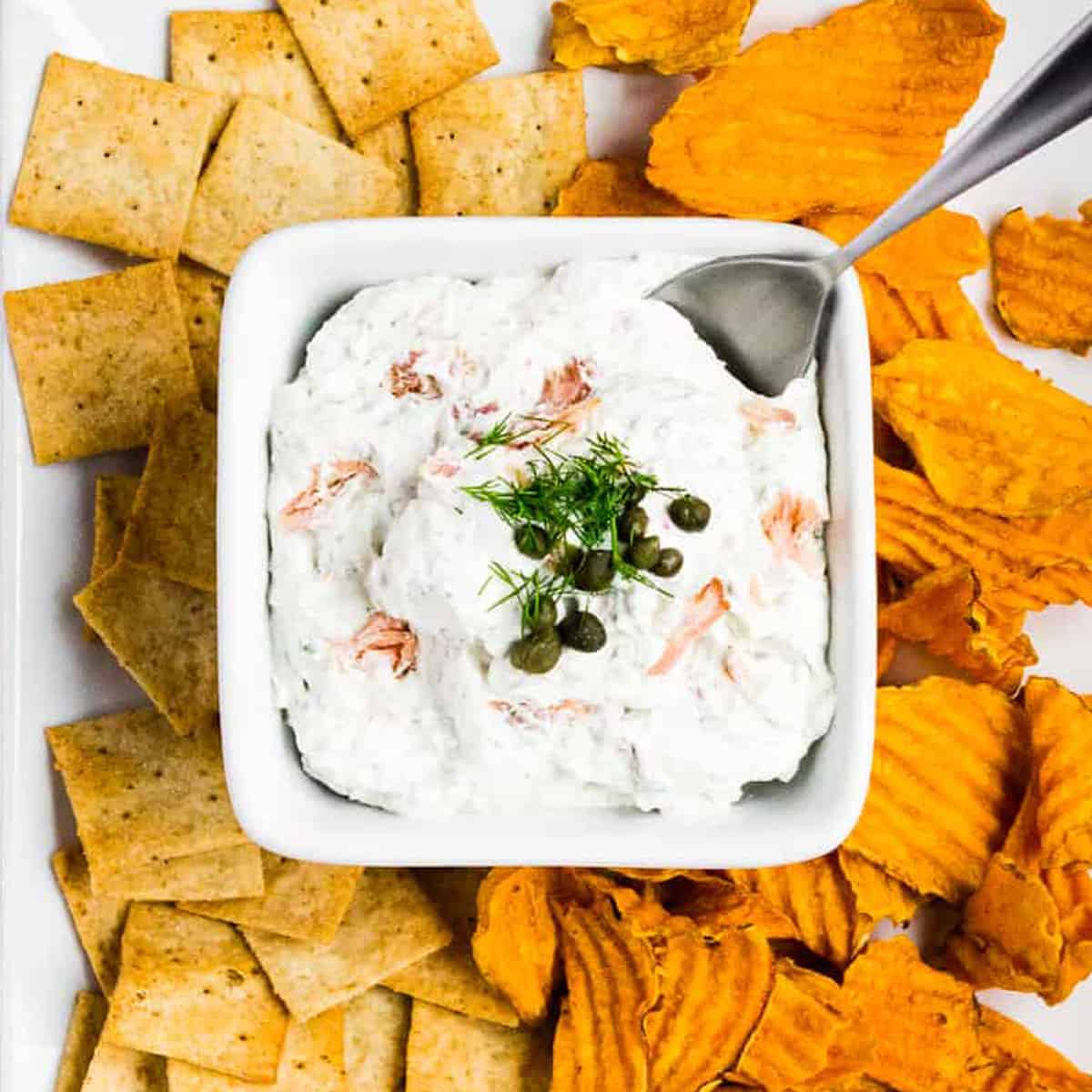 Smoked salmon dip with dill and capers served with almond crackers and sweet potato chips.