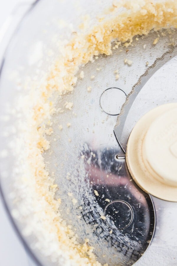Garlic and pine nuts pulverized in a food processor.