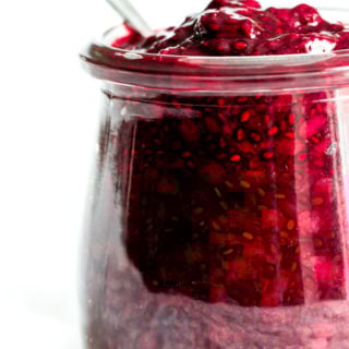 A close-up view of a jar of blackberry chia seed jam made with Oregon Marionberry blackberries.