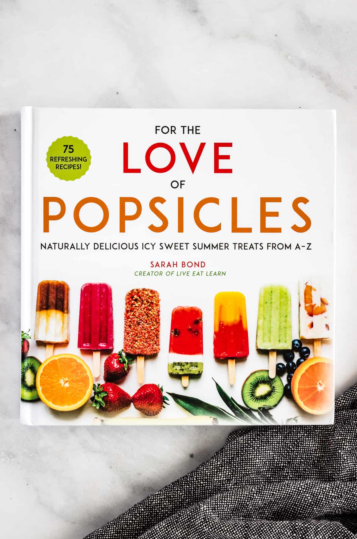 A newly released cookbook authored by Sarah Bond, creator of the blog Live Eat Learn, called For the Love of Popsicles: Naturally Delicious Icy Sweet Summer Treats From A-Z.