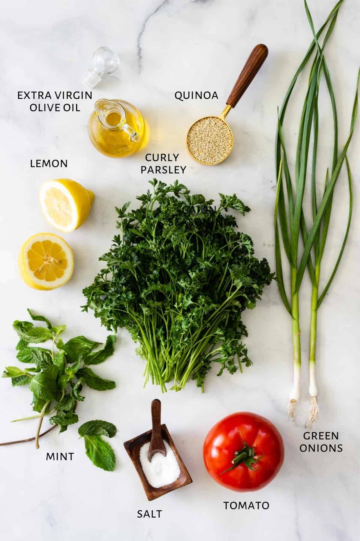 Ingredients are spread out on a marble countertop.