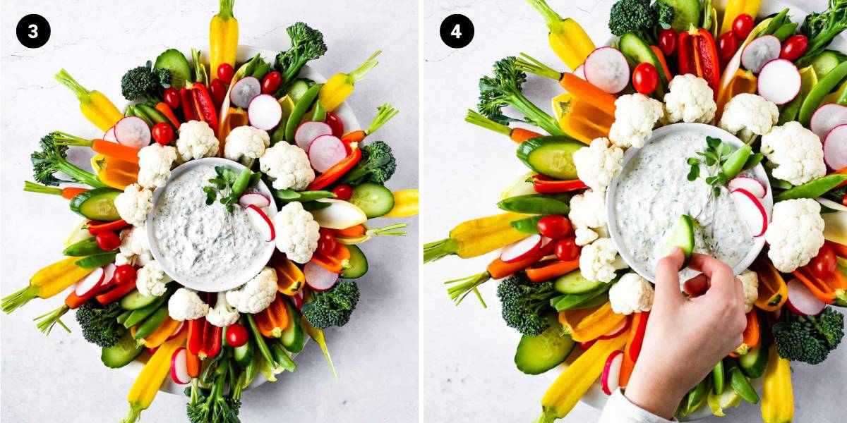 Veggies are arranged the yogurt dip and a hand dips a cucumber into the dip.