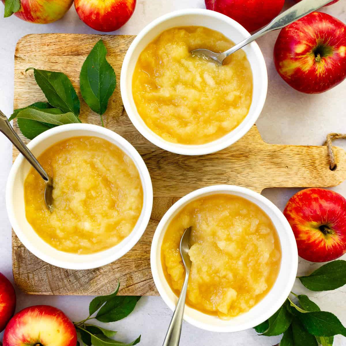 Three bowls of applesauce.