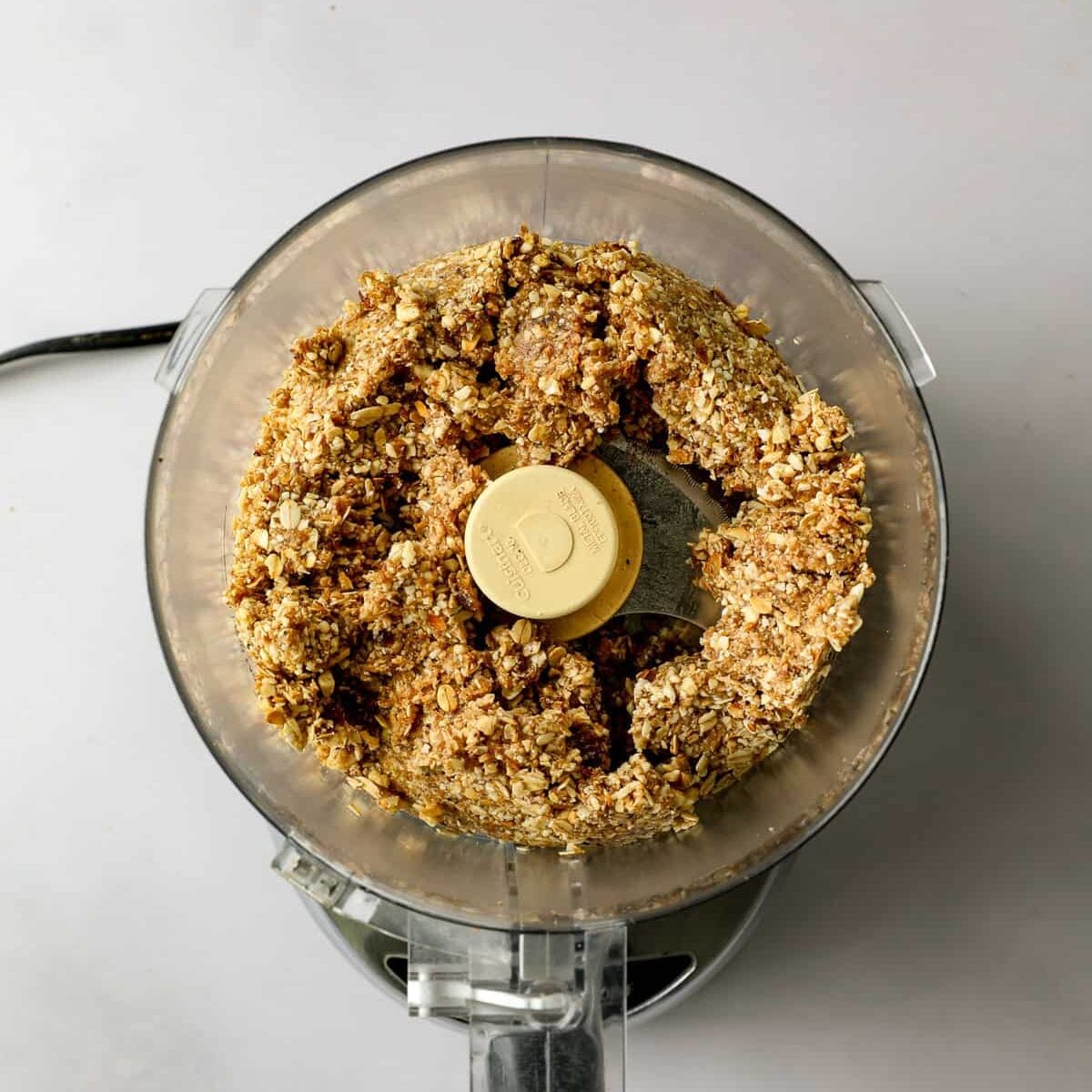 Date base ingredients are processed in a food processor.