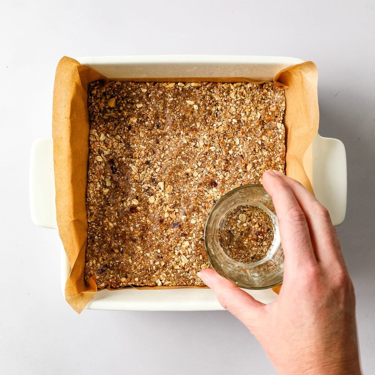 Date bar base is pressed into a pan.