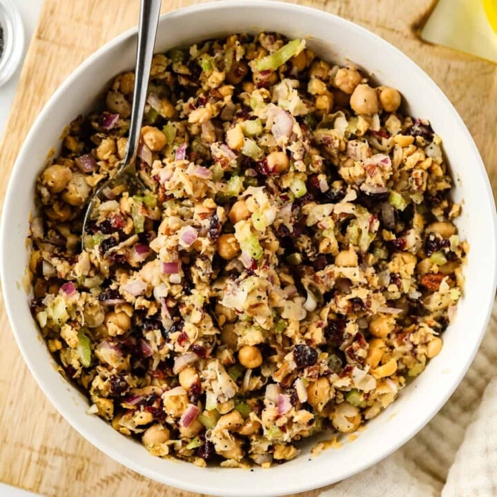 Cranberry pecan chickpea salad in a white bowl.